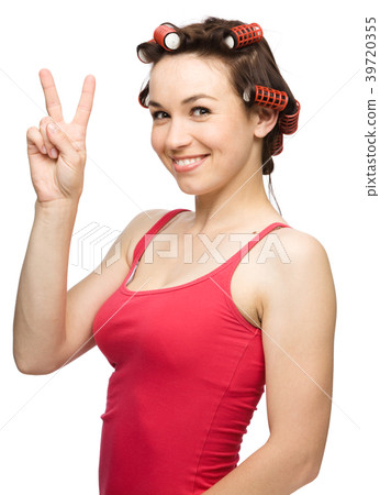 Woman is showing victory sign 39720355