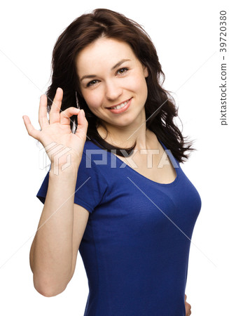 Woman is showing OK sign Woman is showing OK sign 39720380
