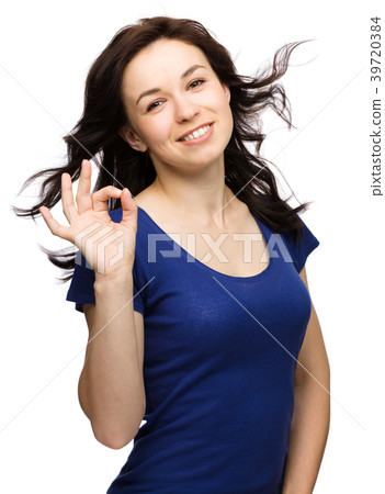 Woman is showing OK sign Woman is showing OK sign 39720384