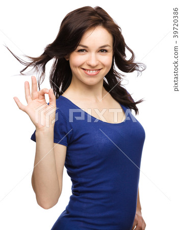 Woman is showing OK sign Woman is showing OK sign 39720386