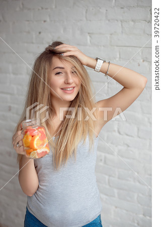 Young woman enjoing with fresh summer lemonade Young woman enjoing with fresh summer lemonade 39720422