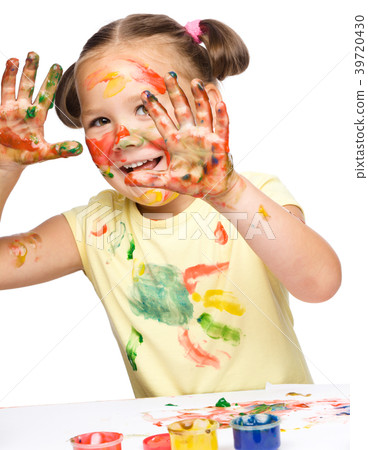 Portrait of a cute girl playing with paints Portrait of a cute girl playing with paints 39720430