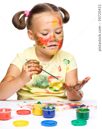 Portrait of a cute girl playing with paints Portrait of a cute girl playing with paints 39720431