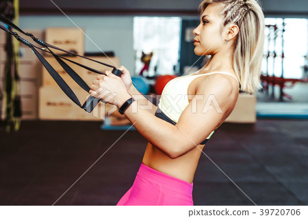 girl doing exercises with ropes girl doing exercises with ropes 39720706