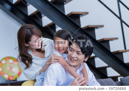 Young family, sofa, house, smiling face 39720888