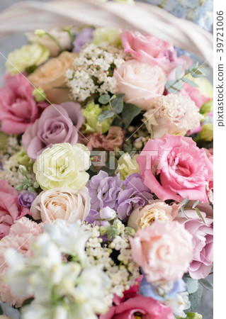 Beautiful flower composition a bouquet in a wicker 39721006