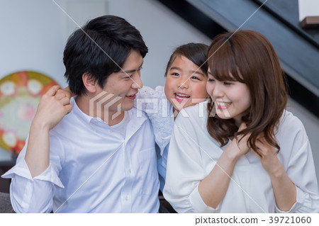 Young family, sofa, house, smiling face 39721060
