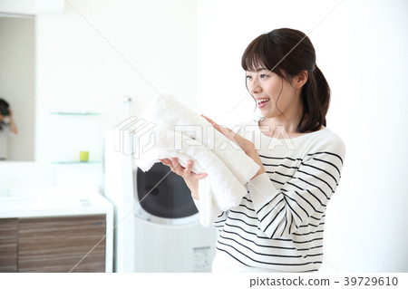 A woman with a bath towel A woman with a bath towel 39729610