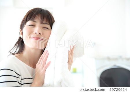 A woman with a bath towel A woman with a bath towel 39729624