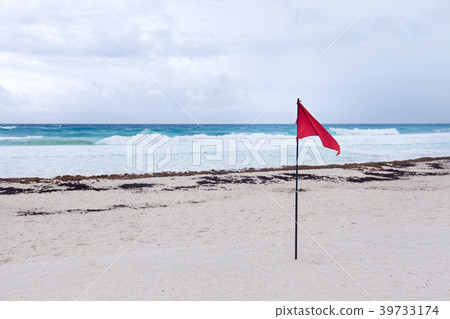 Lifeguard red flag on caribbean beach Lifeguard red flag on caribbean beach 39733174