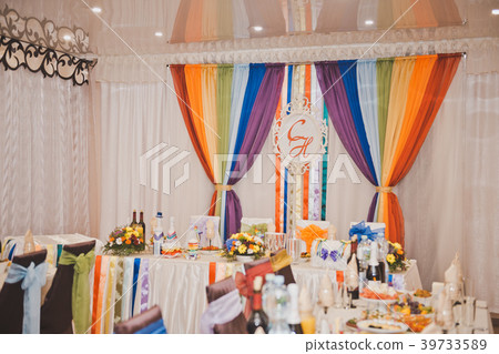 A Banquet hall decorated with rainbow ribbons A Banquet hall decorated with rainbow ribbons 39733589