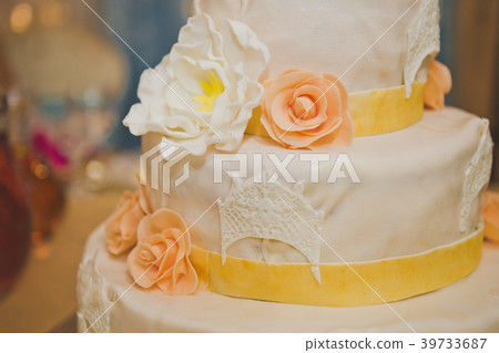Gentle decorated with yellow and beige flowers Gentle decorated with yellow and beige flowers 39733687