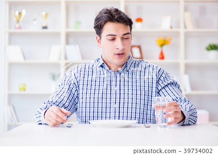 Man on diet waiting for food in restaurant 39734002