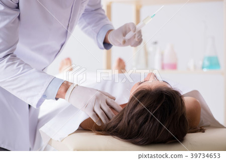 Police coroner examining dead body corpse in 39734653