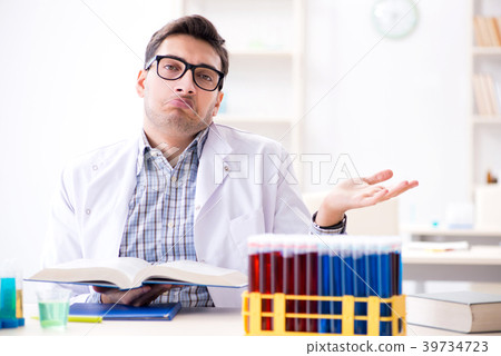 Chemistry student doing chemical experiments at 39734723