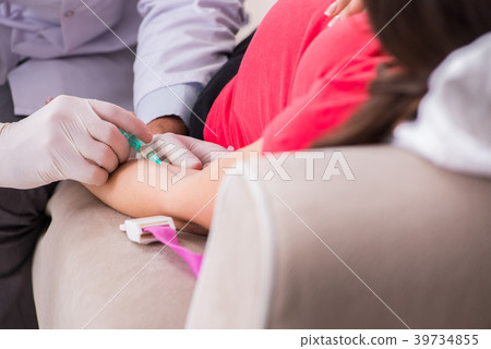 Pregnant woman patient visiting doctor for regular Pregnant woman patient visiting doctor for regular 39734855