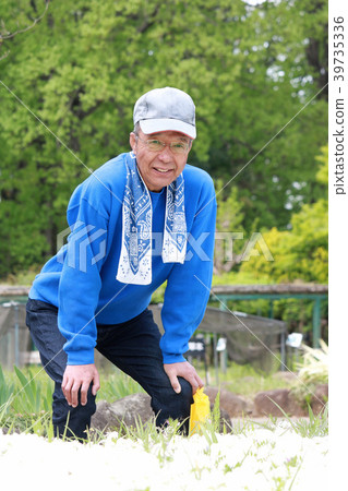 Senior man standing in a low back posture 39735336