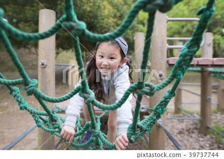 Girls playing in the park Girls playing in the park 39737744