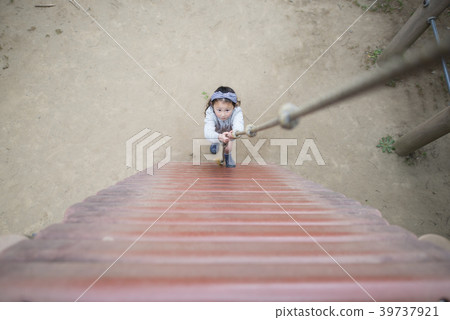 Girl climbing on rope Girl climbing on rope 39737921