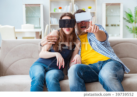 Young family playing games with virtual reality 39739552