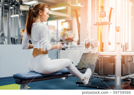 Woman training with weight-lifting training Woman training with weight-lifting training 39739560