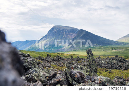 Frozen lava field in volcano valley with old 39739816