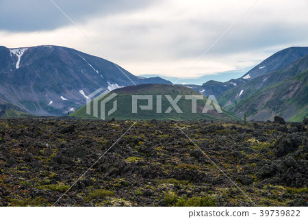 Frozen lava field in volcano valley with old Frozen lava field in volcano valley with old 39739822