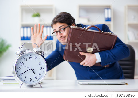 Businessman in bad time management concept Businessman in bad time management concept 39739880