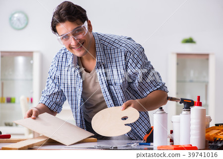 Young man in woodworking hobby concept Young man in woodworking hobby concept 39741016
