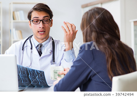Doctor in corruption concept with being offered 39742494