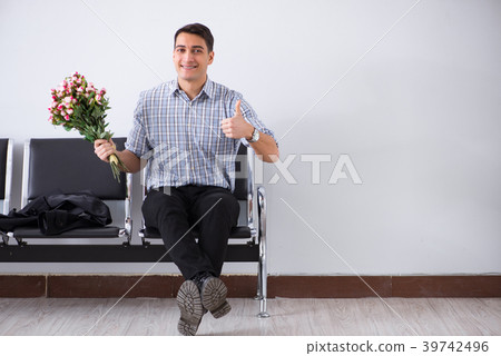 Happy dad waiting for news in maternity house 39742496
