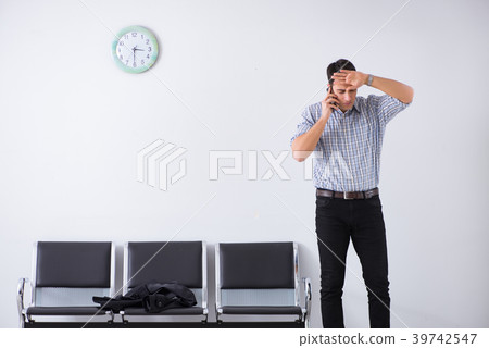 Man nervously impatiently waiting in the lobby 39742547