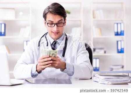 Doctor in corruption concept with being offered 39742549