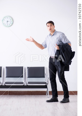 Man nervously impatiently waiting in the lobby Man nervously impatiently waiting in the lobby 39742550