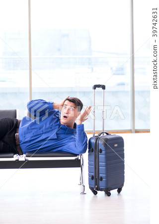 Man wairing to boarding in airport lounge room Man wairing to boarding in airport lounge room 39742631