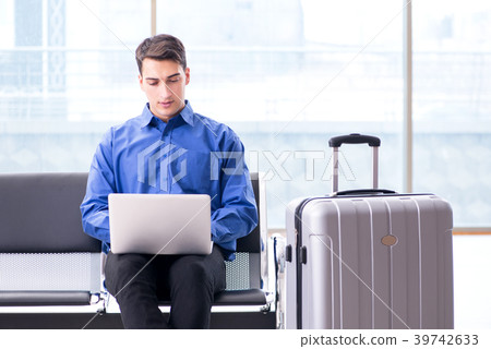Man wairing to boarding in airport lounge room 39742633