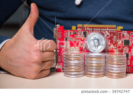 Young man in bitcoin mining concept Young man in bitcoin mining concept 39742747