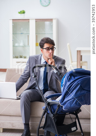 Businessman looking after newborn baby at home and Businessman looking after newborn baby at home and 39742953