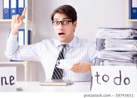Businessman working on his to-do list 39743651