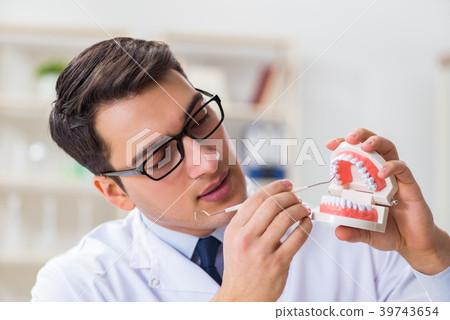 Young dentist working in the dentistry hospital 39743654
