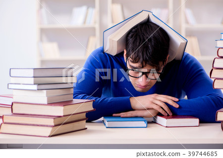 Male student preparing for exams in college 39744685