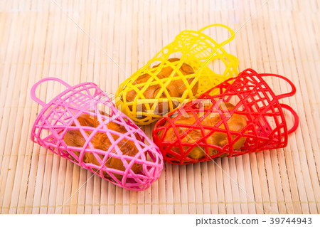 Piggy moon cakes in colorful basket 39744943