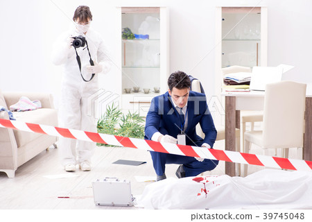 Forensics investigator at the scene of office 39745048
