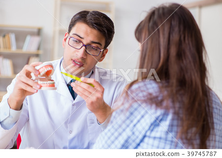 Patient visiting dentist doctor for preliminary 39745787
