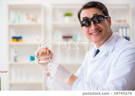 Young dentist working in the dentistry hospital 39745879