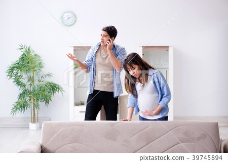 Pregnant woman with husband at home 39745894
