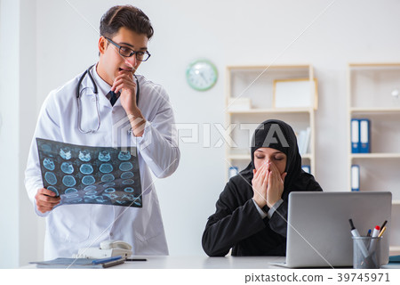 Muslim woman visiting doctor for regular check-up 39745971
