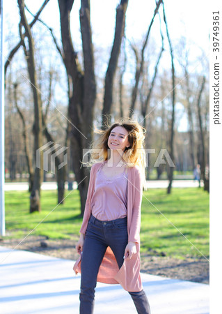 Young girl resting in spring park. Young girl resting in spring park. 39749361