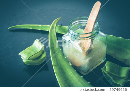 Fresh aloe vera and jelly in glass bottle 39749636