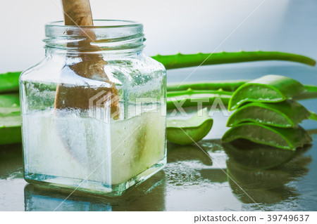 Fresh aloe vera and jelly in glass bottle 39749637